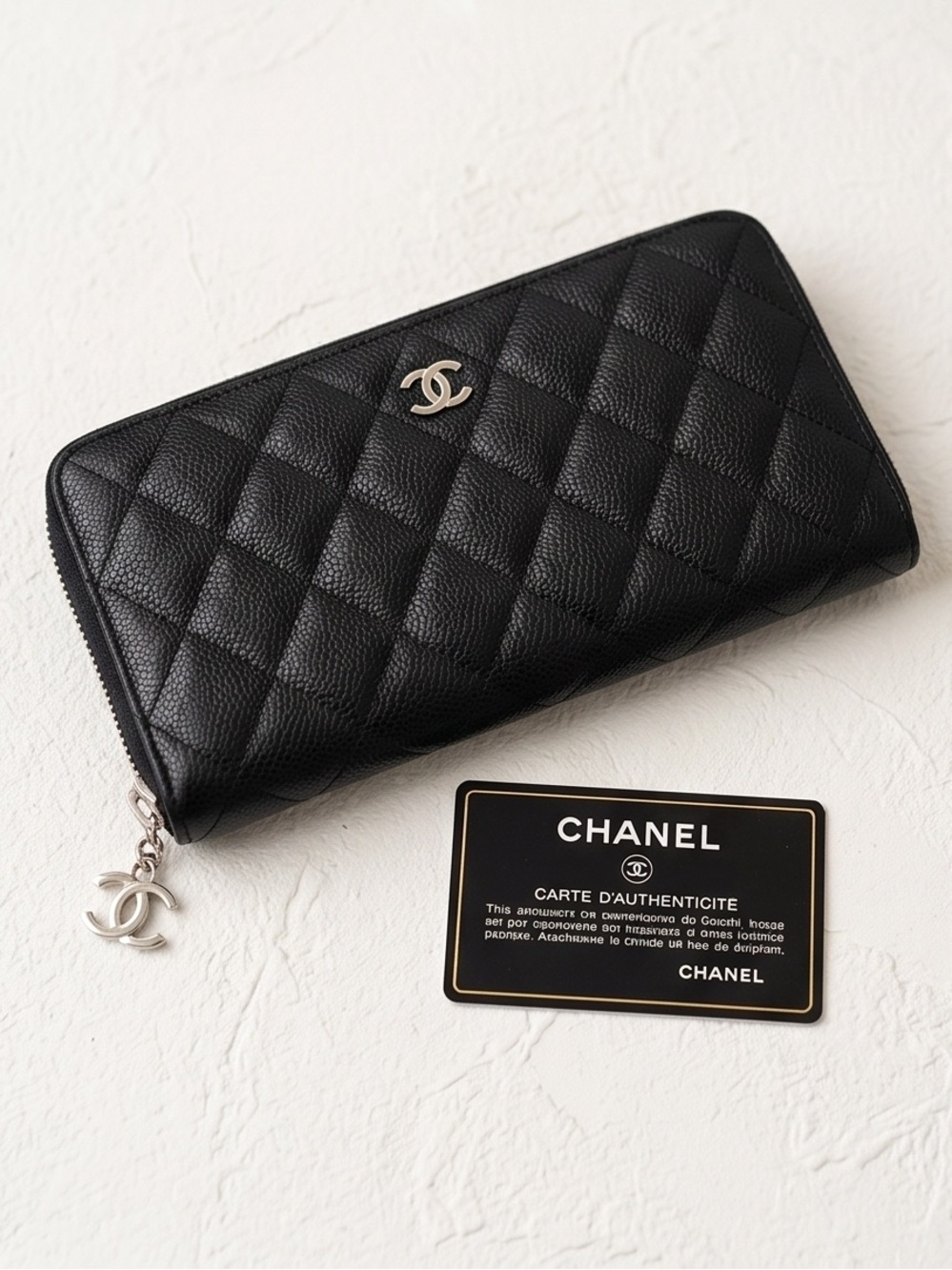 CHANEL Black Quilted Caviar Leather Zip Around Wallet with Silver CC